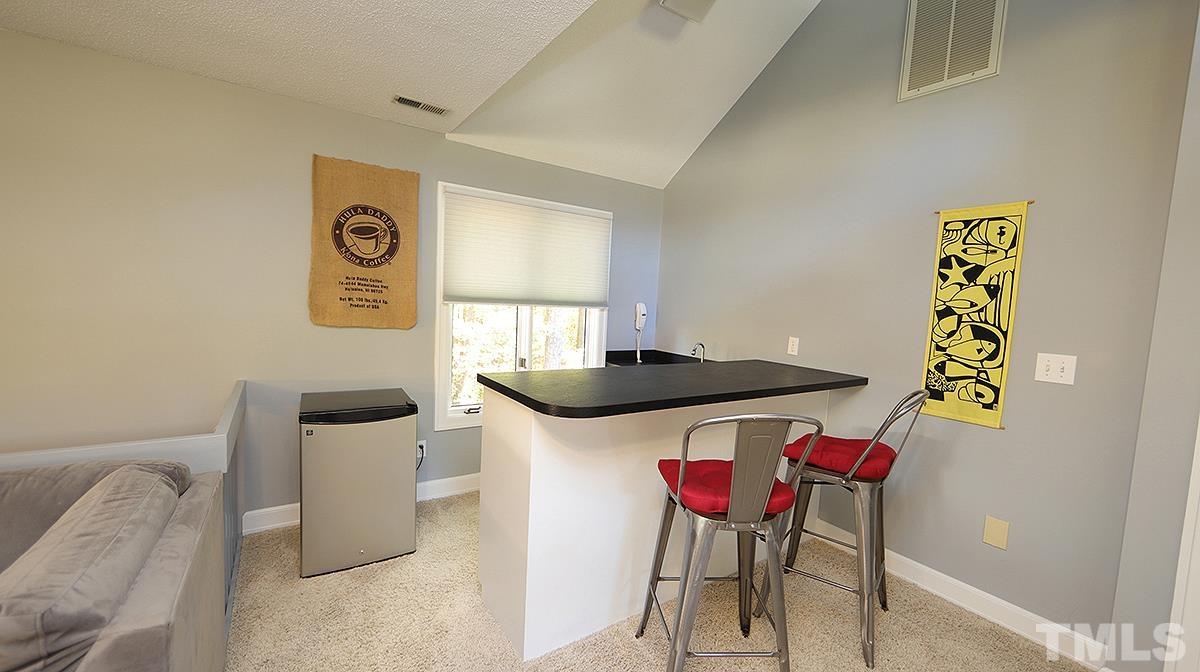 7300 Rainwater Road Raleigh, NC 27615 - Photo 14 of 18 a kitchen with a table and chairs