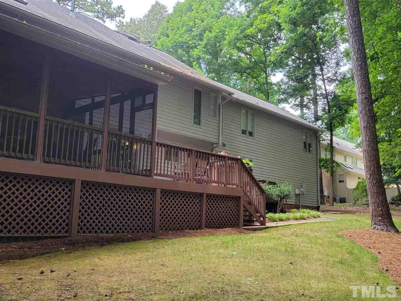 7300 Rainwater Road Raleigh, NC 27615 - Photo 4 of 18 a view of a house with a wooden roof deck