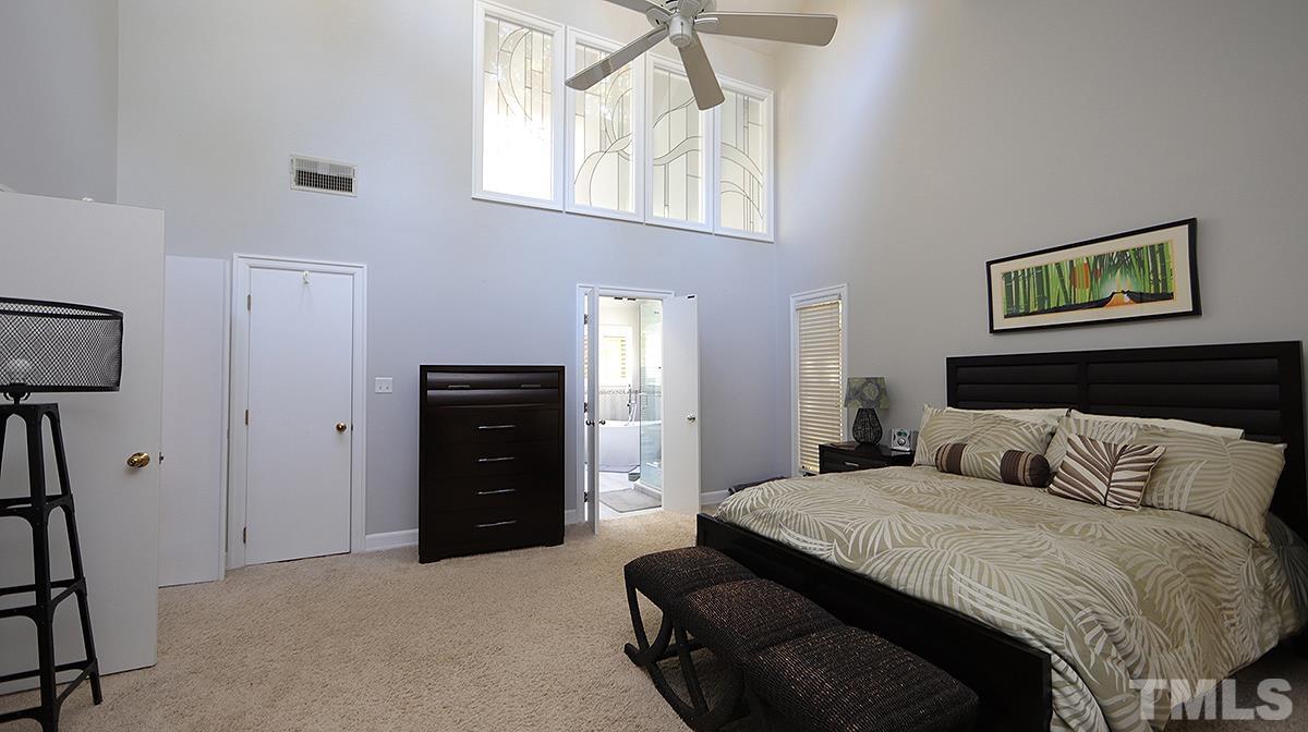 7300 Rainwater Road Raleigh, NC 27615 - Photo 9 of 18 a bedroom with a bed and a window