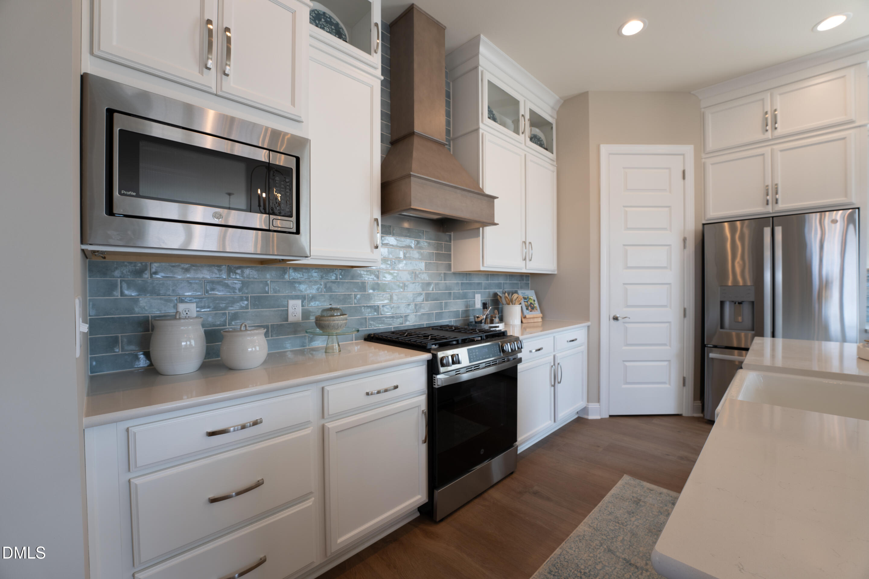 331 Oak Meadow Lane Angier, NC 27501 - Photo 11 of 32 a kitchen with stainless steel appliances granite countertop a refrigerator stove and sink