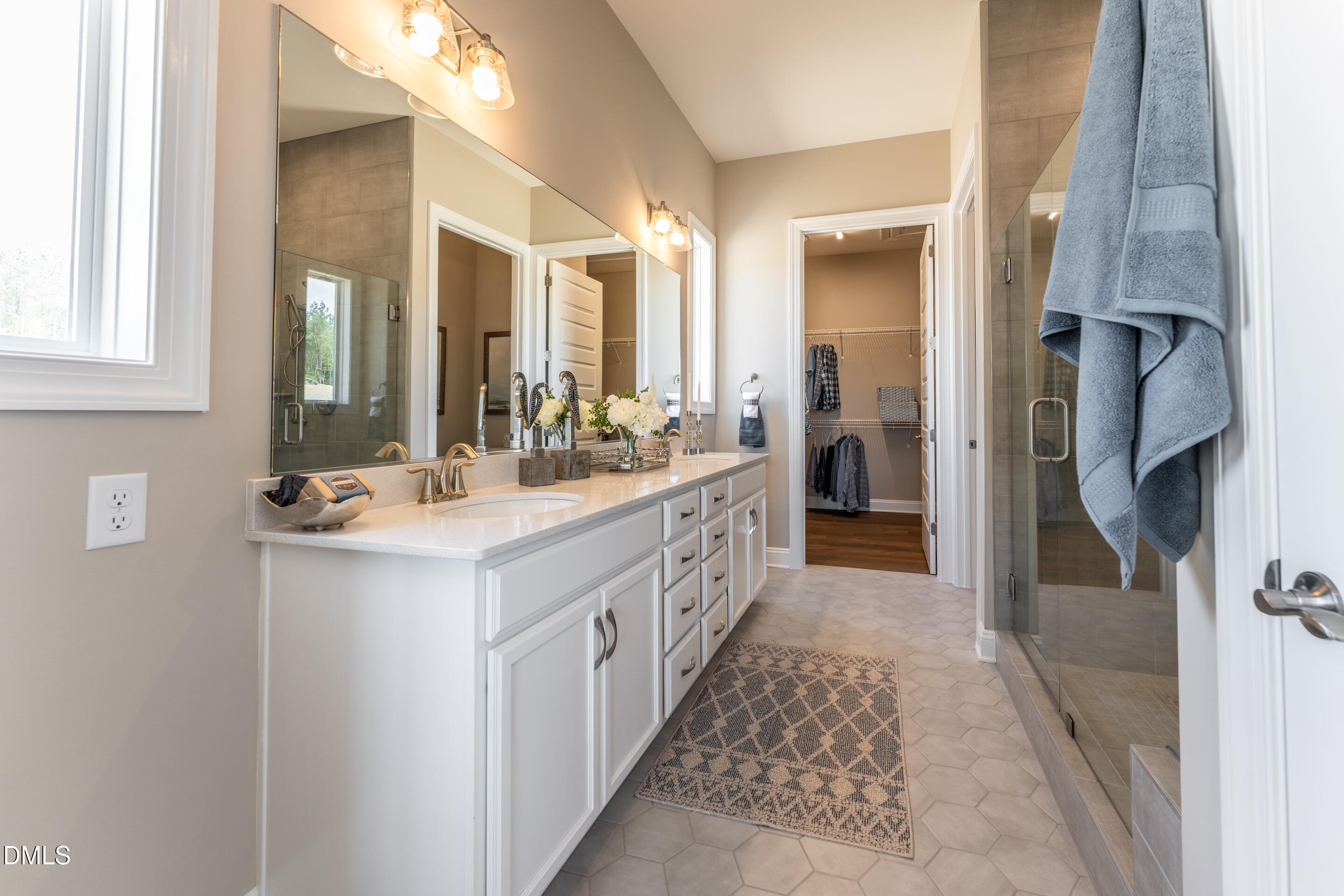 331 Oak Meadow Lane Angier, NC 27501 - Photo 17 of 32 a bathroom with a double vanity sink and a mirror