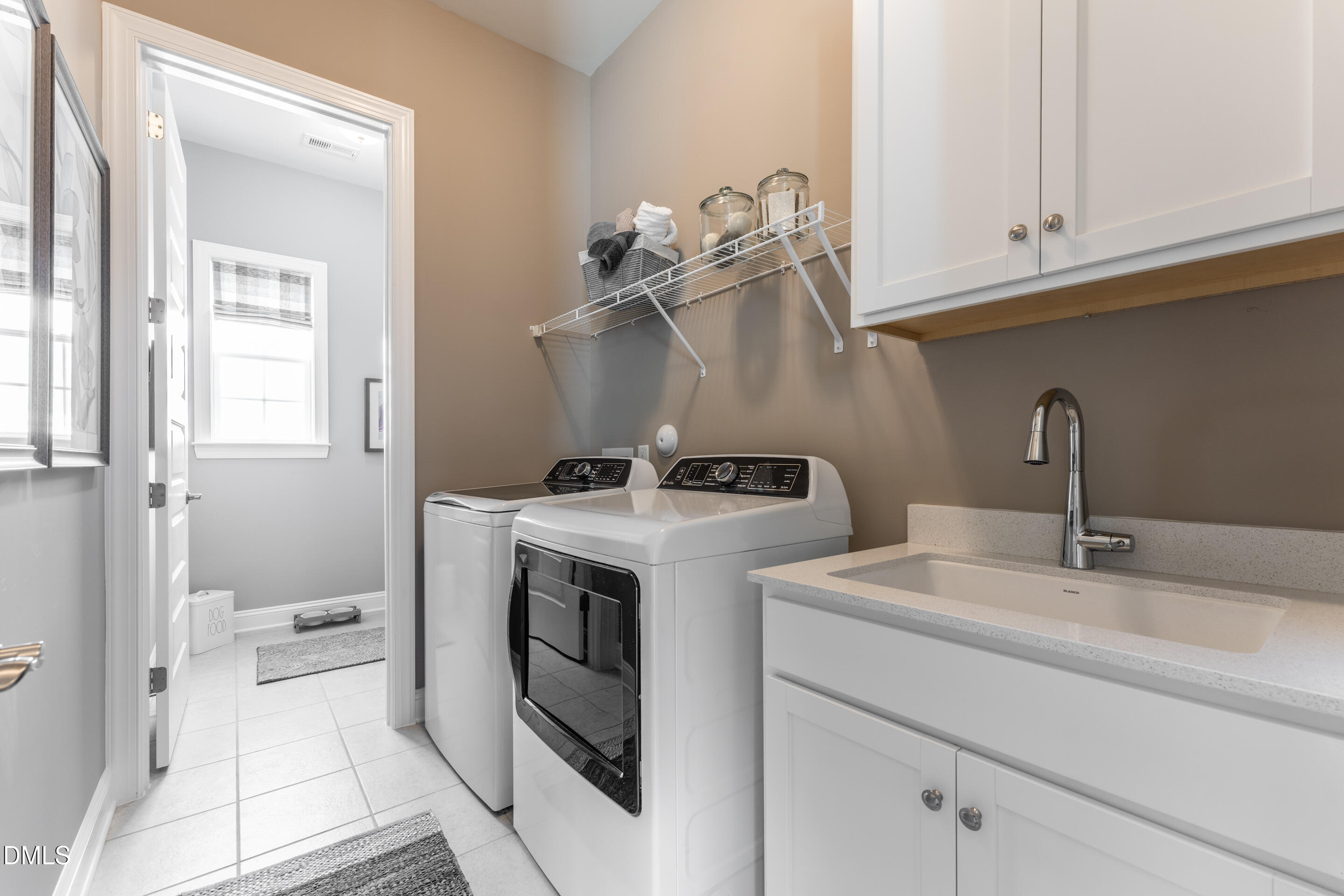 331 Oak Meadow Lane Angier, NC 27501 - Photo 26 of 32 a utility room with sink dryer and washer