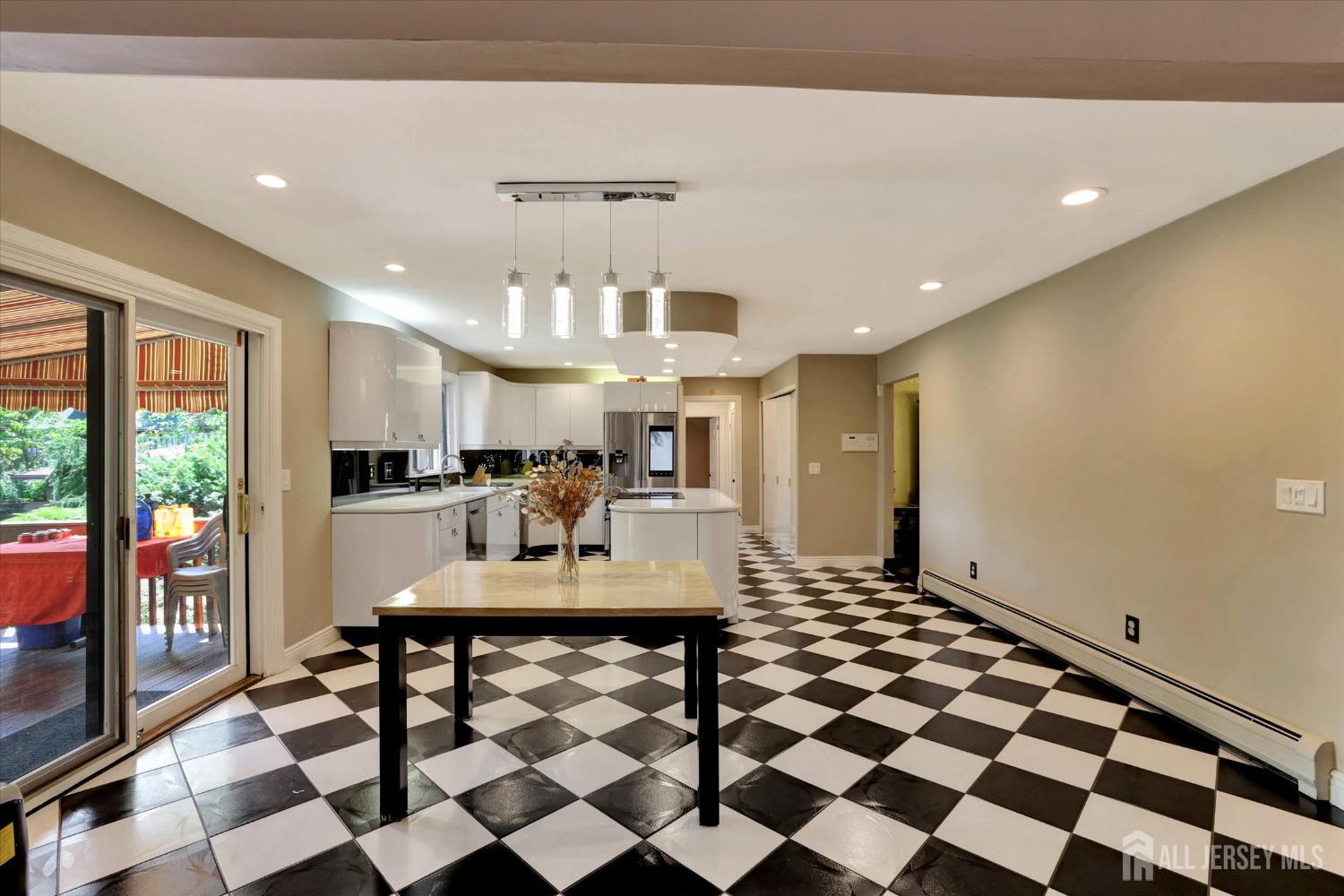 403 New Dover Road Colonia, NJ 07067 - Photo 13 of 51 a view of a dining room with a table and chairs
