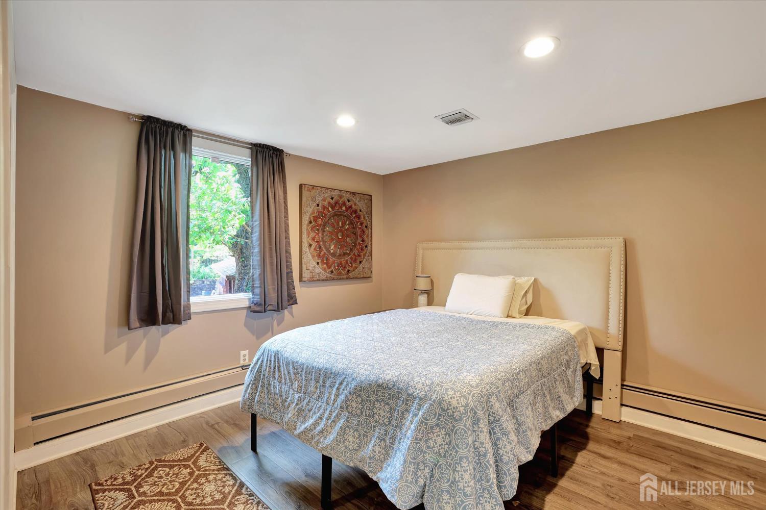 403 New Dover Road Colonia, NJ 07067 - Photo 19 of 51 a bedroom with a bed and a window