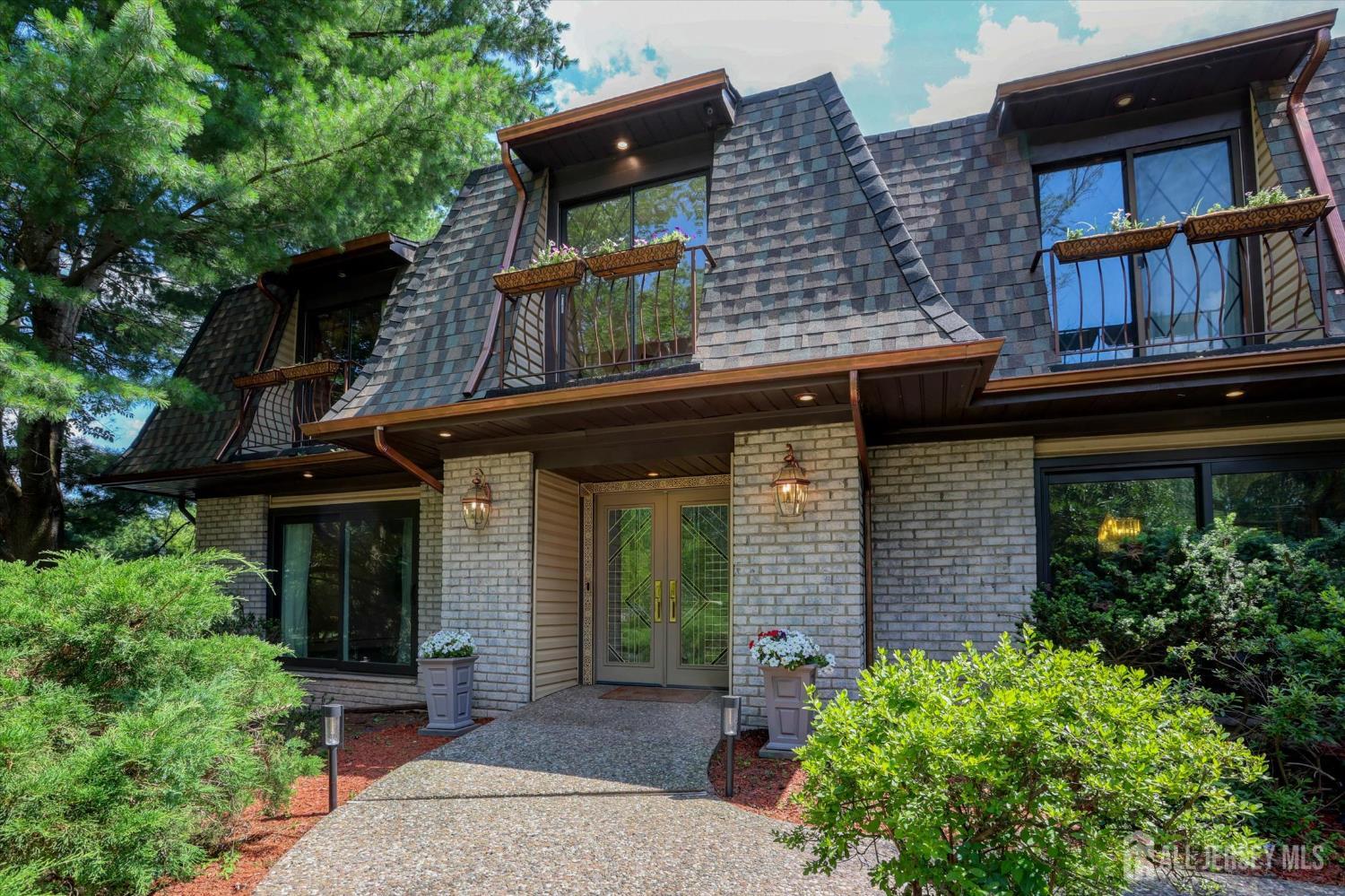 403 New Dover Road Colonia, NJ 07067 - Photo 2 of 51 front view of a house with a small yard