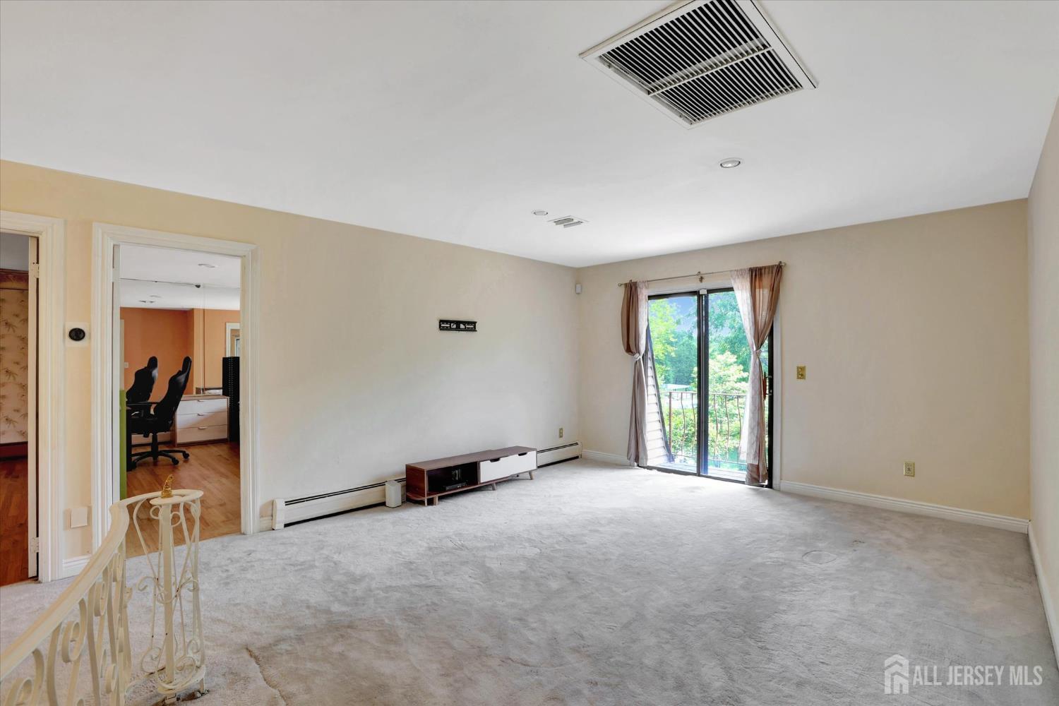 403 New Dover Road Colonia, NJ 07067 - Photo 21 of 51 a view of an empty room with a window