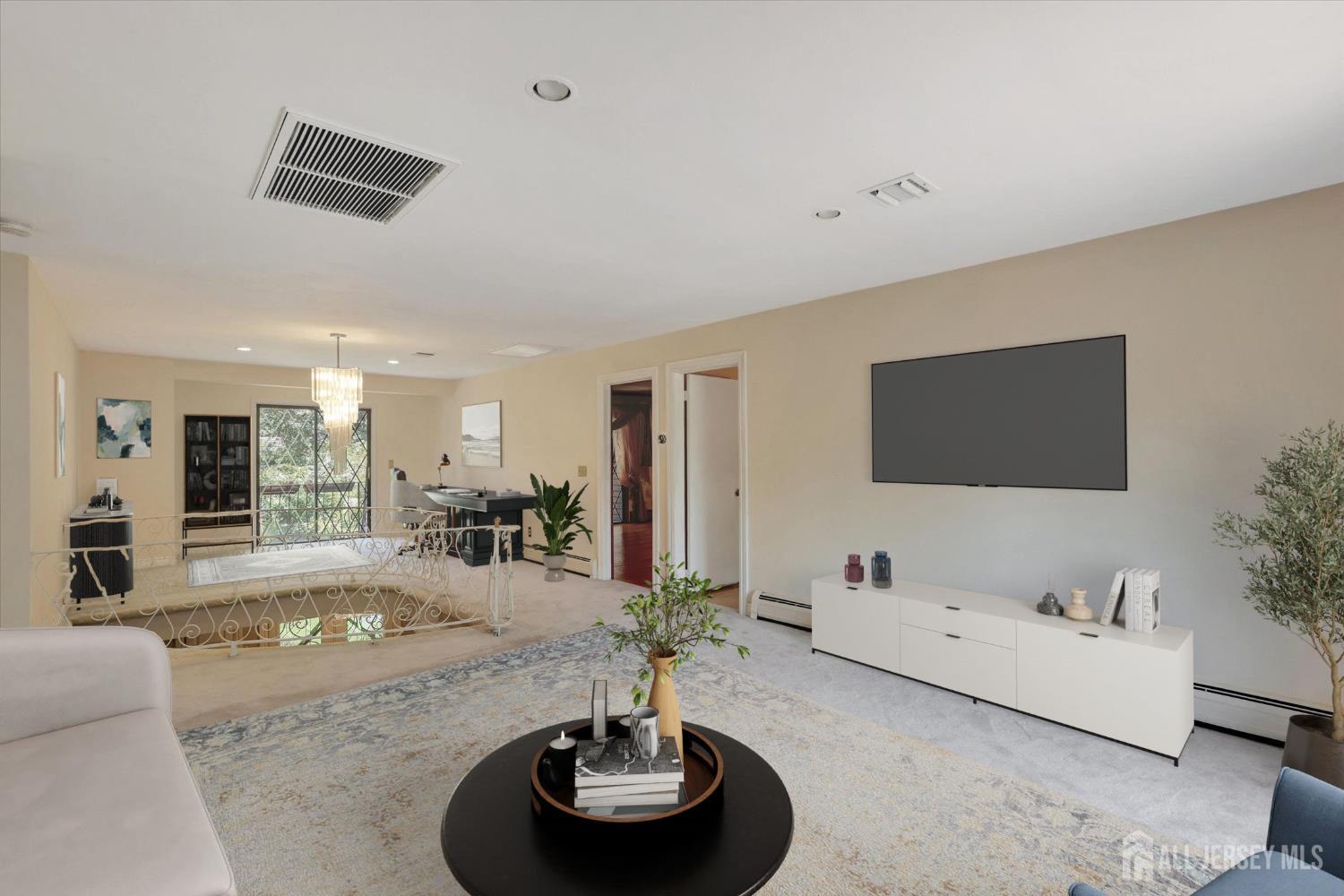 403 New Dover Road Colonia, NJ 07067 - Photo 22 of 51 a living room with furniture and a flat screen tv