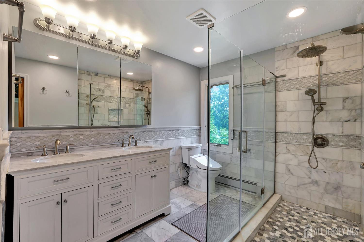 403 New Dover Road Colonia, NJ 07067 - Photo 27 of 51 a bathroom with a granite countertop sink mirror and double