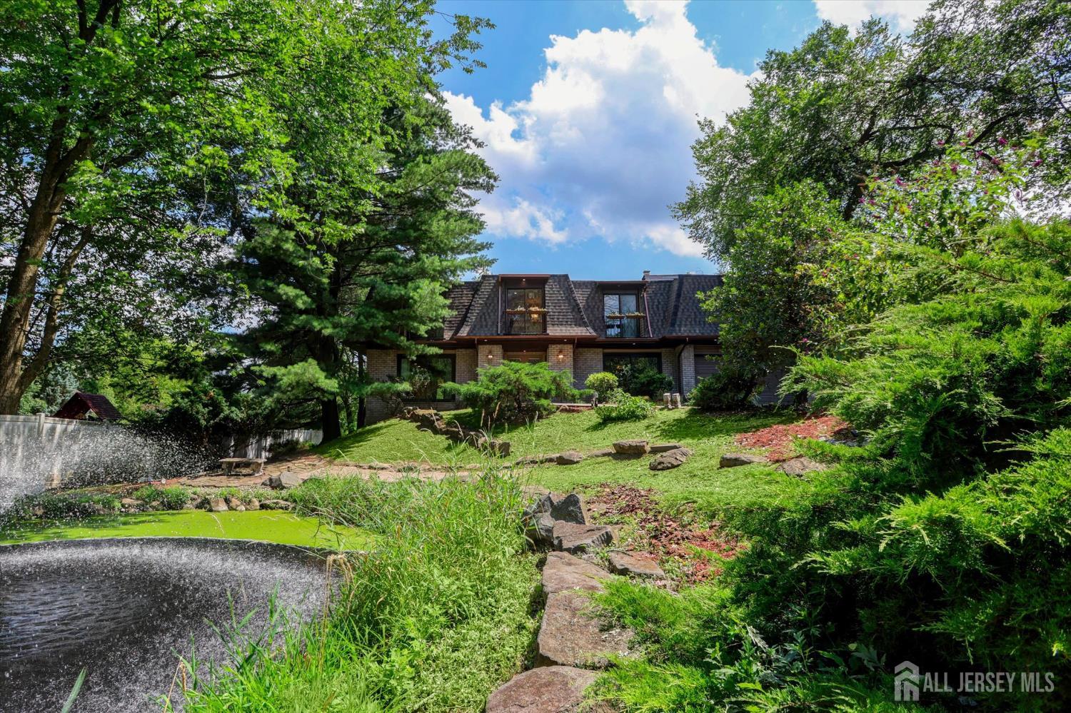 403 New Dover Road Colonia, NJ 07067 - Photo 3 of 51 a view of a house with a yard and tree s
