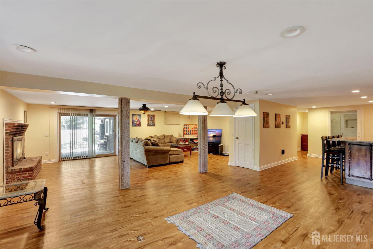 403 New Dover Road Colonia, NJ 07067 - Photo 34 of 51 a living room with furniture and a chandelier