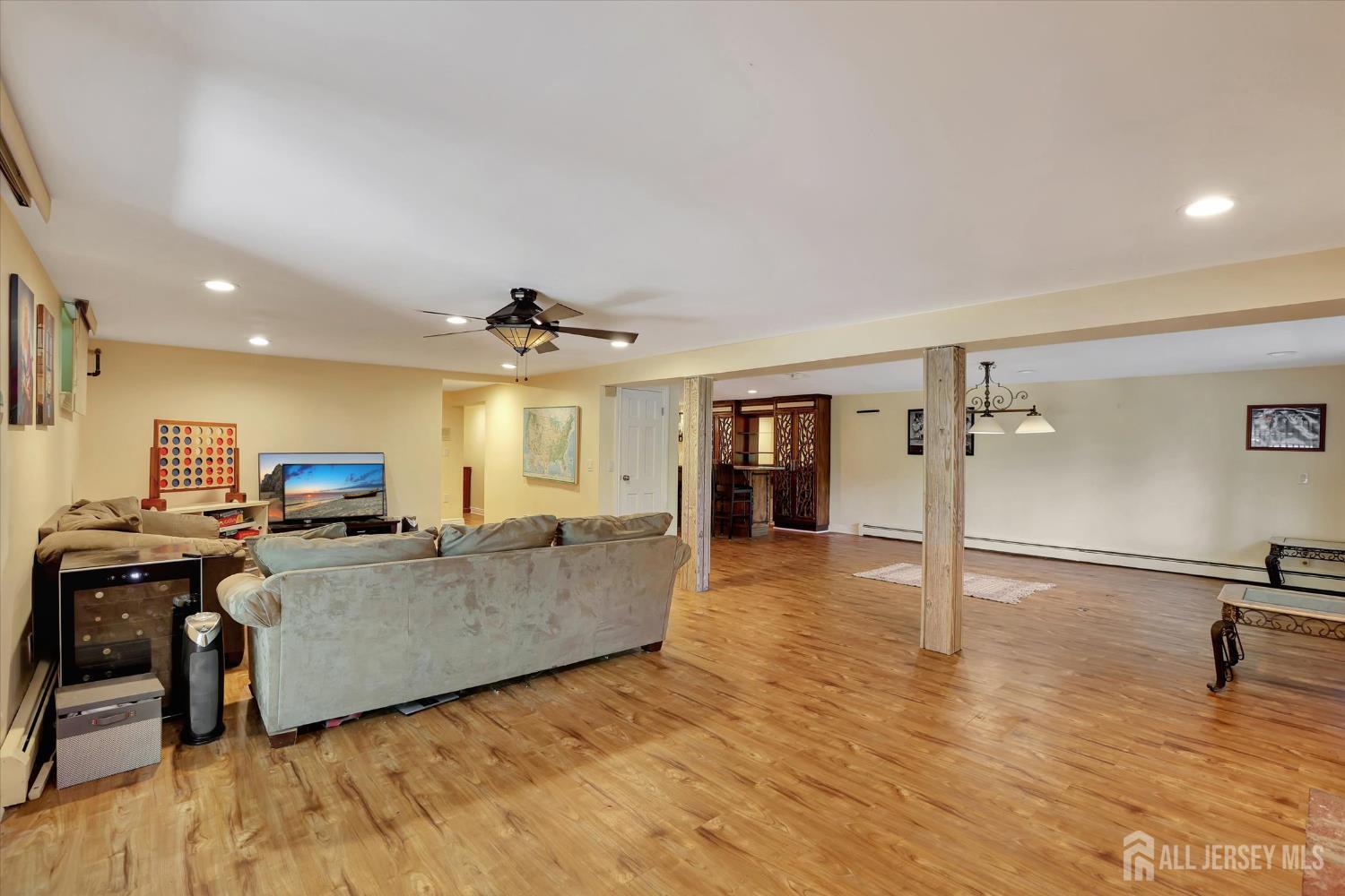 403 New Dover Road Colonia, NJ 07067 - Photo 35 of 51 a living room with furniture and a flat screen tv