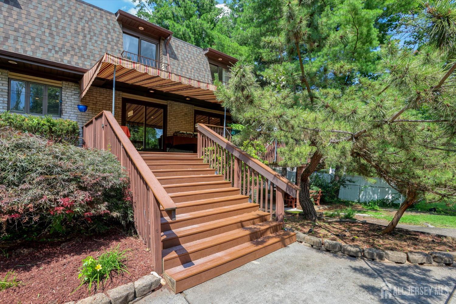 403 New Dover Road Colonia, NJ 07067 - Photo 42 of 51 a view of house with backyard and trees