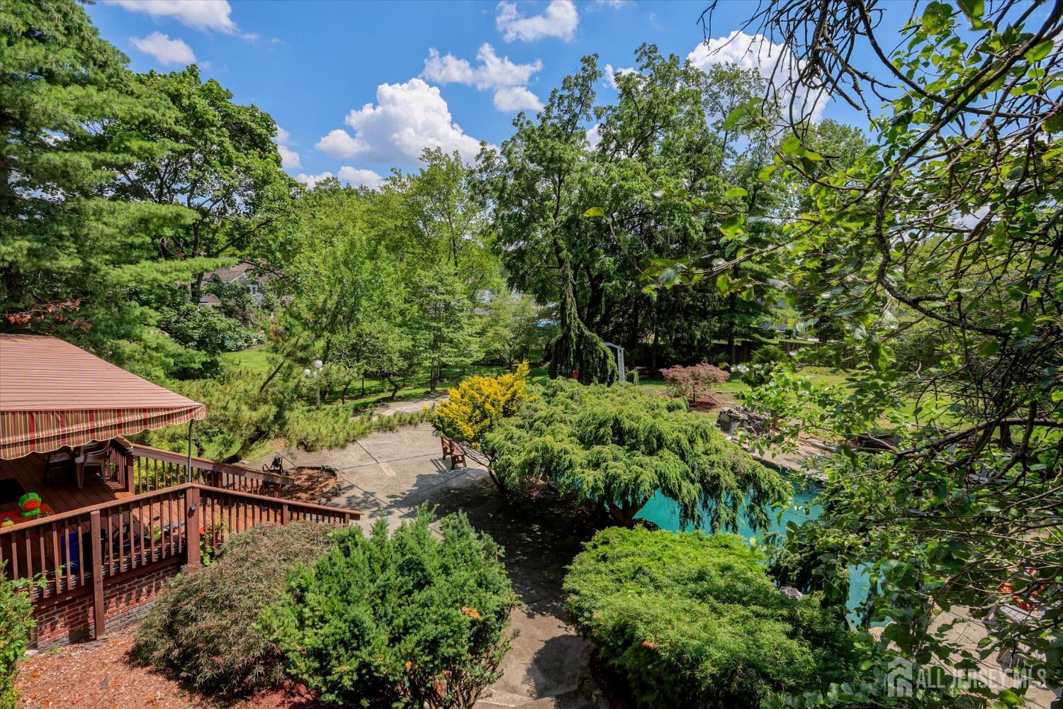 403 New Dover Road Colonia, NJ 07067 - Photo 50 of 51 a view of backyard with plants and trees