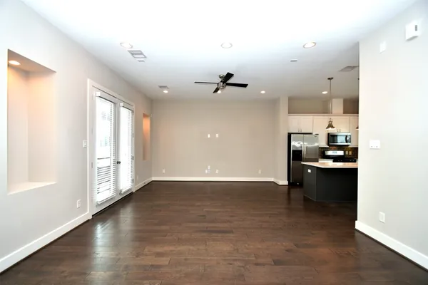 a view of a kitchen with a sink and a window