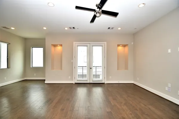 a view of room with wooden floor and window
