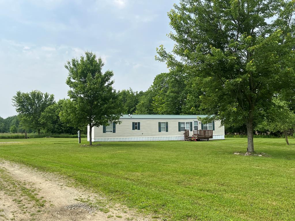 a view of a house with a big yard