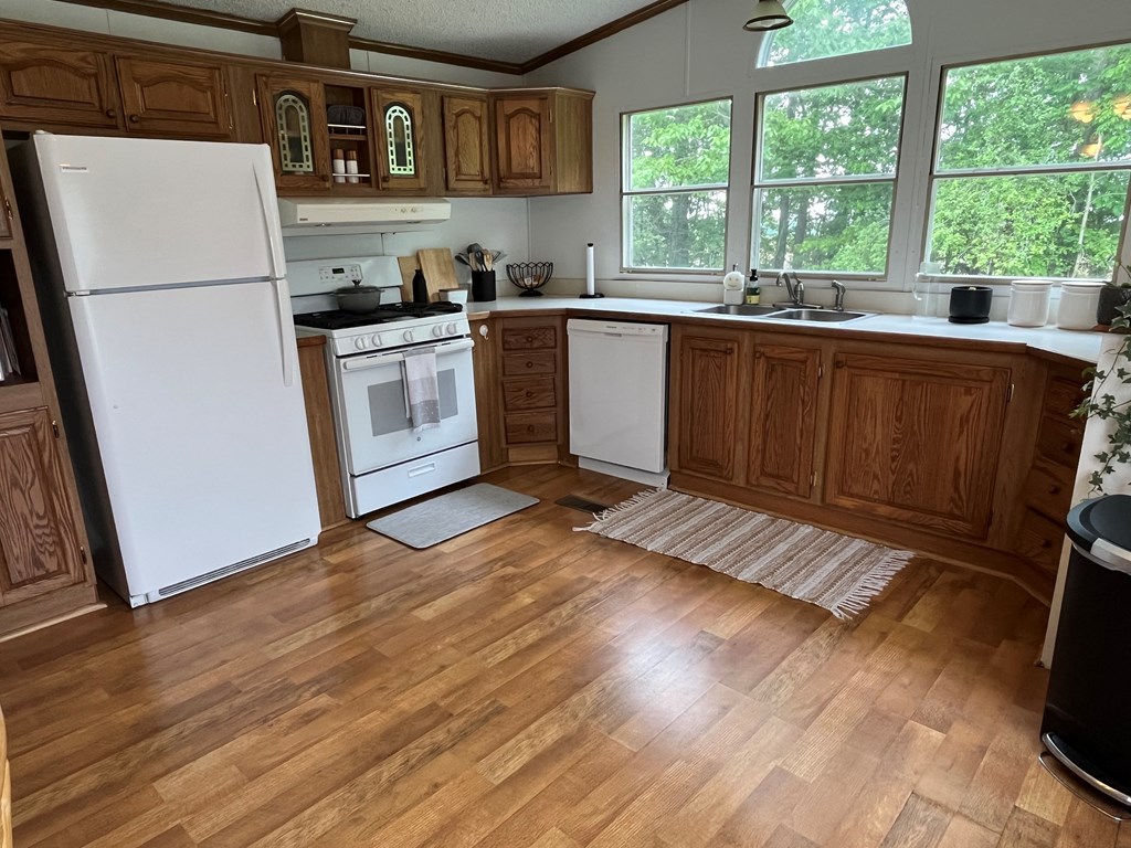 23701 Range Road Union City, PA 16438 - Photo 13 of 33 a kitchen with a sink a wooden floor and a window
