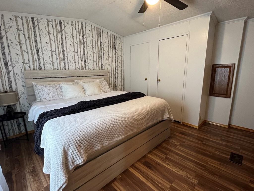 23701 Range Road Union City, PA 16438 - Photo 19 of 33 a bedroom with a bed and a chandelier