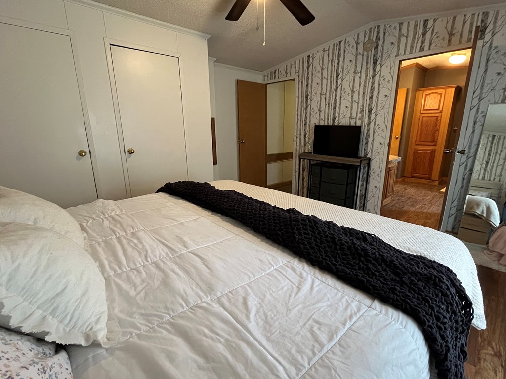23701 Range Road Union City, PA 16438 - Photo 20 of 33 a bedroom with a bed a flat tv screen and dresser
