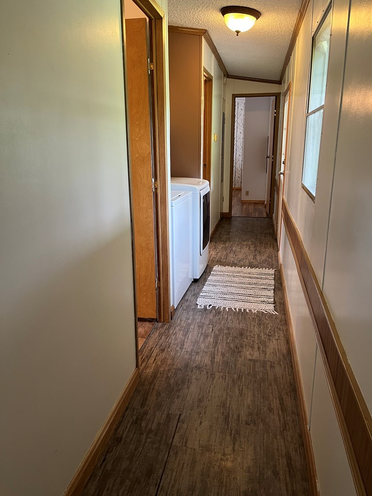 23701 Range Road Union City, PA 16438 - Photo 23 of 33 a view of a hallway with wooden floor and staircase