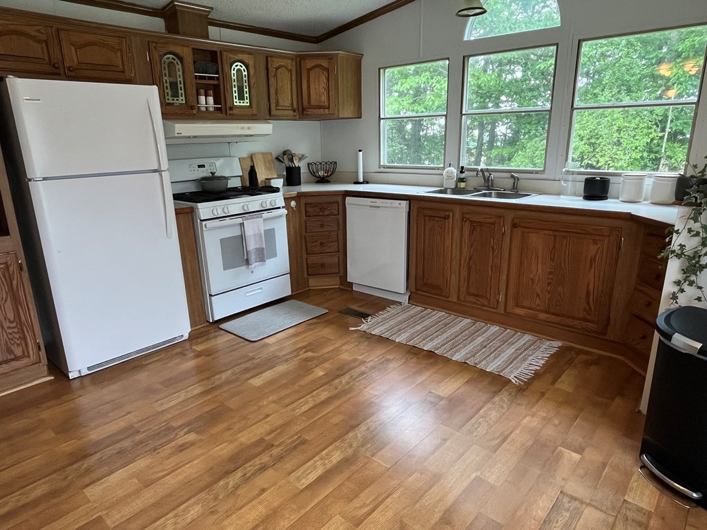 23701 Range Road Union City, PA 16438 - Photo 10 of 33 a kitchen with a sink a stove a refrigerator and a window