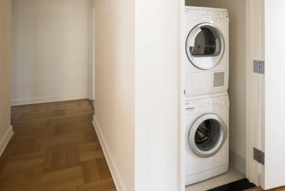 400 West 63rd Street, Unit 1702 Manhattan, NY 10069 - Photo 5 of 11 a utility room with dryer and washer