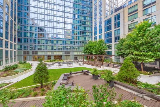 400 West 63rd Street, Unit 1702 Manhattan, NY 10069 - Photo 10 of 11 a view of swimming pool with outdoor seating and plants