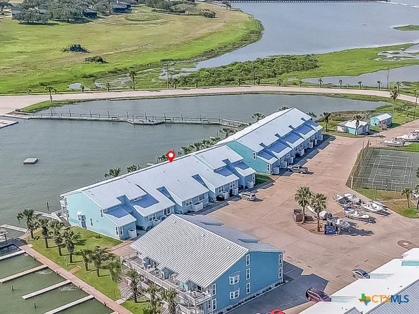 an aerial view of a house with a ocean view
