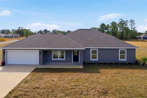 front view of a house with a yard