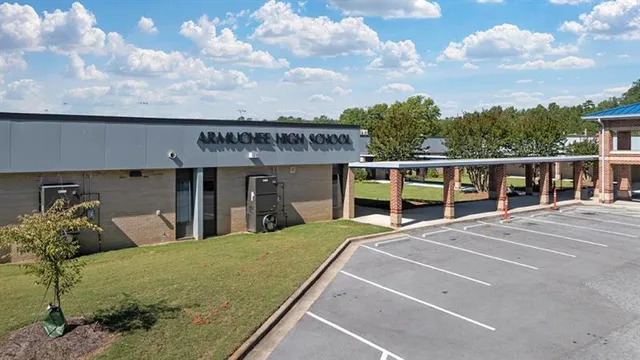 an aerial view of a house with pool swimming pool and mountains