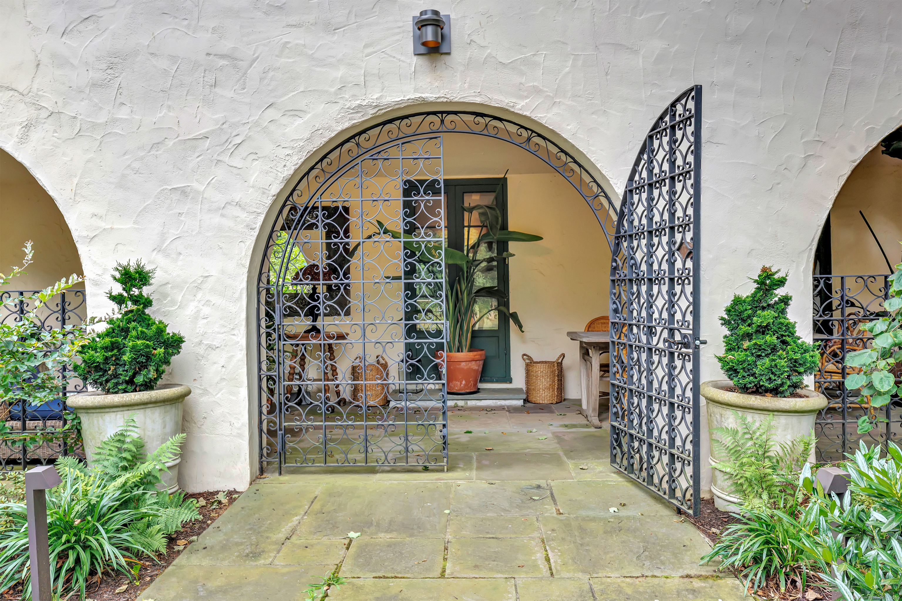61 Clapboard Hill Road Westport, CT 06880 - Photo 7 of 40 Custom iron gates flank the front entrance.