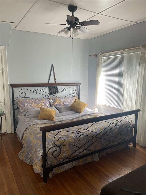 50 Chestnut Street Lynn, MA 01902 - Photo 5 of 13 a bed sitting in a bedroom next to a window