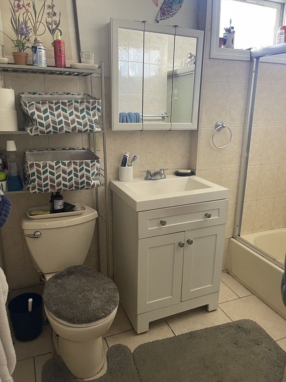 50 Chestnut Street Lynn, MA 01902 - Photo 6 of 13 a bathroom with a sink toilet and shower