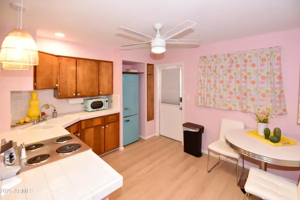 a kitchen with stainless steel appliances granite countertop a sink and cabinets
