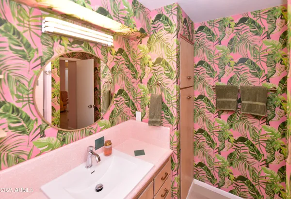 a view of a porch with furniture and a yard