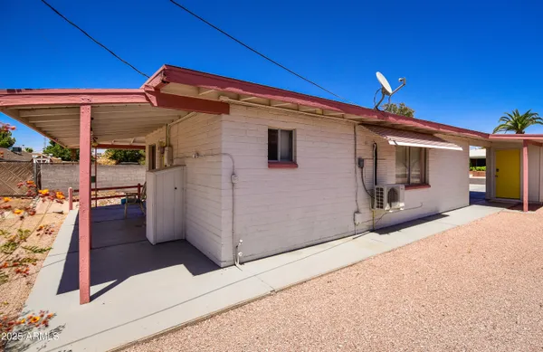 a utility room with cabinets washer and dryer