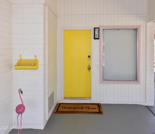 a living room with furniture and a lamp