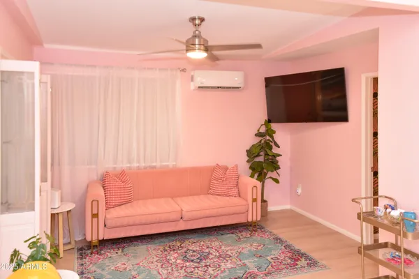 a bedroom with furniture and a large mirror