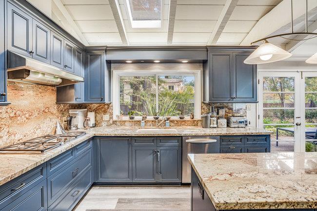 1 Edge Road Atherton, CA 94027 - Photo 12 of 33 a kitchen with a sink and wooden cabinets