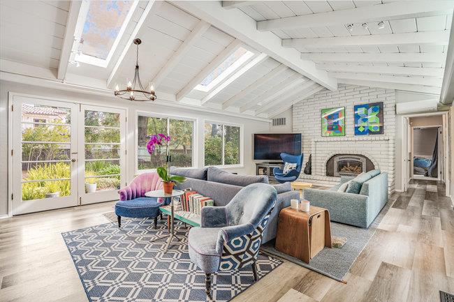 1 Edge Road Atherton, CA 94027 - Photo 15 of 33 a living room with furniture a fireplace and a flat screen tv