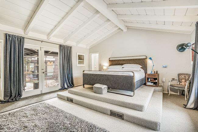 1 Edge Road Atherton, CA 94027 - Photo 18 of 33 a bedroom with a large bed and wooden floor