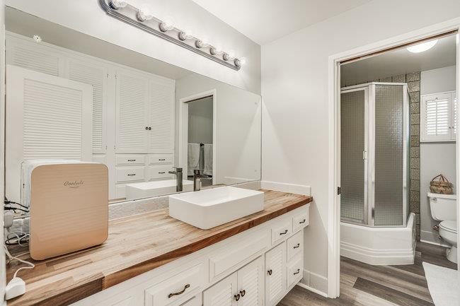 1 Edge Road Atherton, CA 94027 - Photo 20 of 33 a bathroom with a granite countertop sink and a mirror