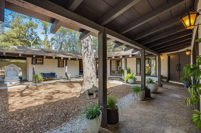 1 Edge Road Atherton, CA 94027 - Photo 4 of 33 a view of a porch with furniture and floor to ceiling window
