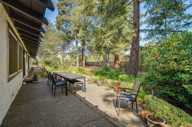 1 Edge Road Atherton, CA 94027 - Photo 31 of 33 a backyard of a house with table and chairs