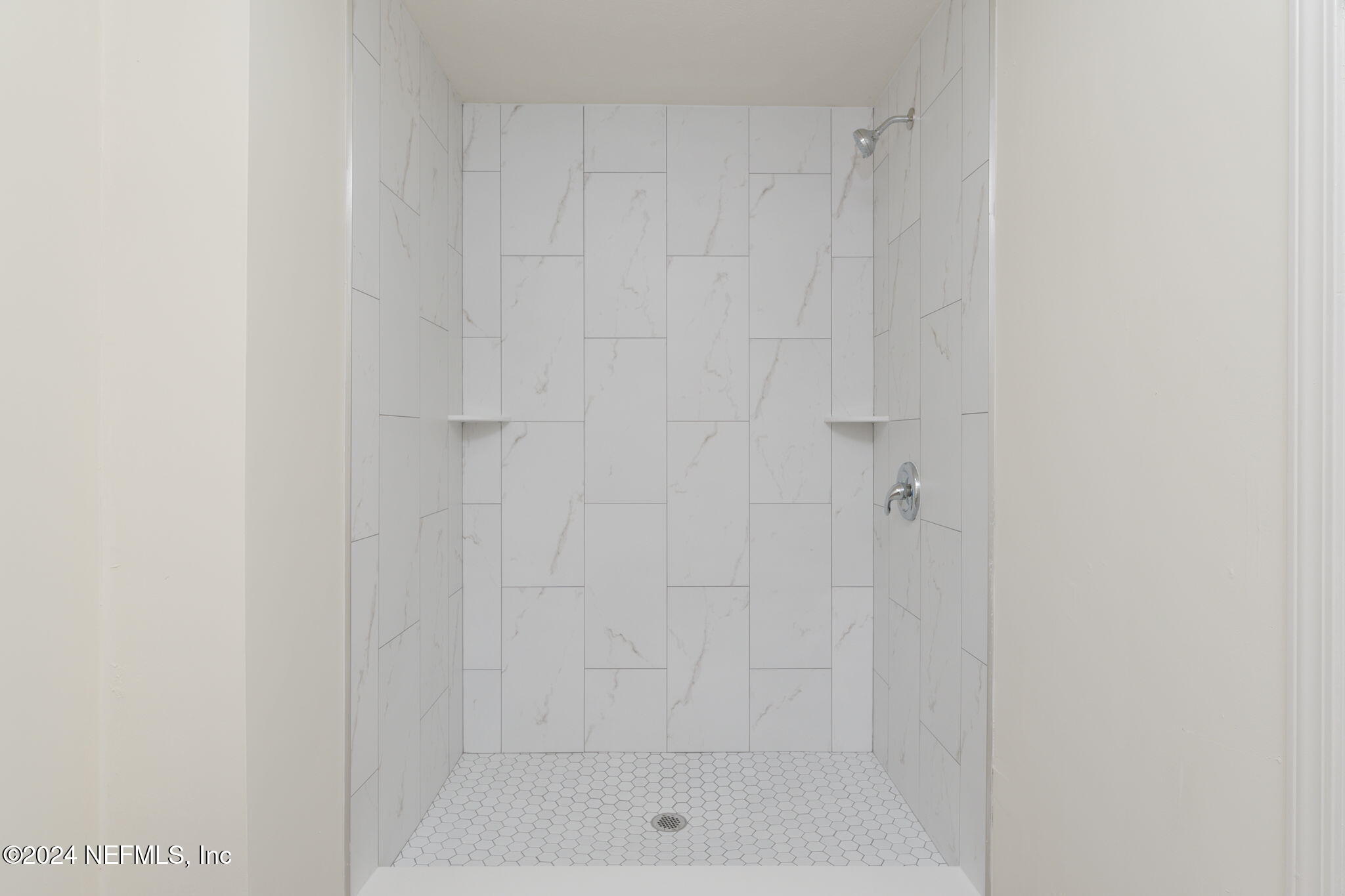 4526 Lambing Road Jacksonville, FL 32210 - Photo 12 of 32 a bathroom with a shower