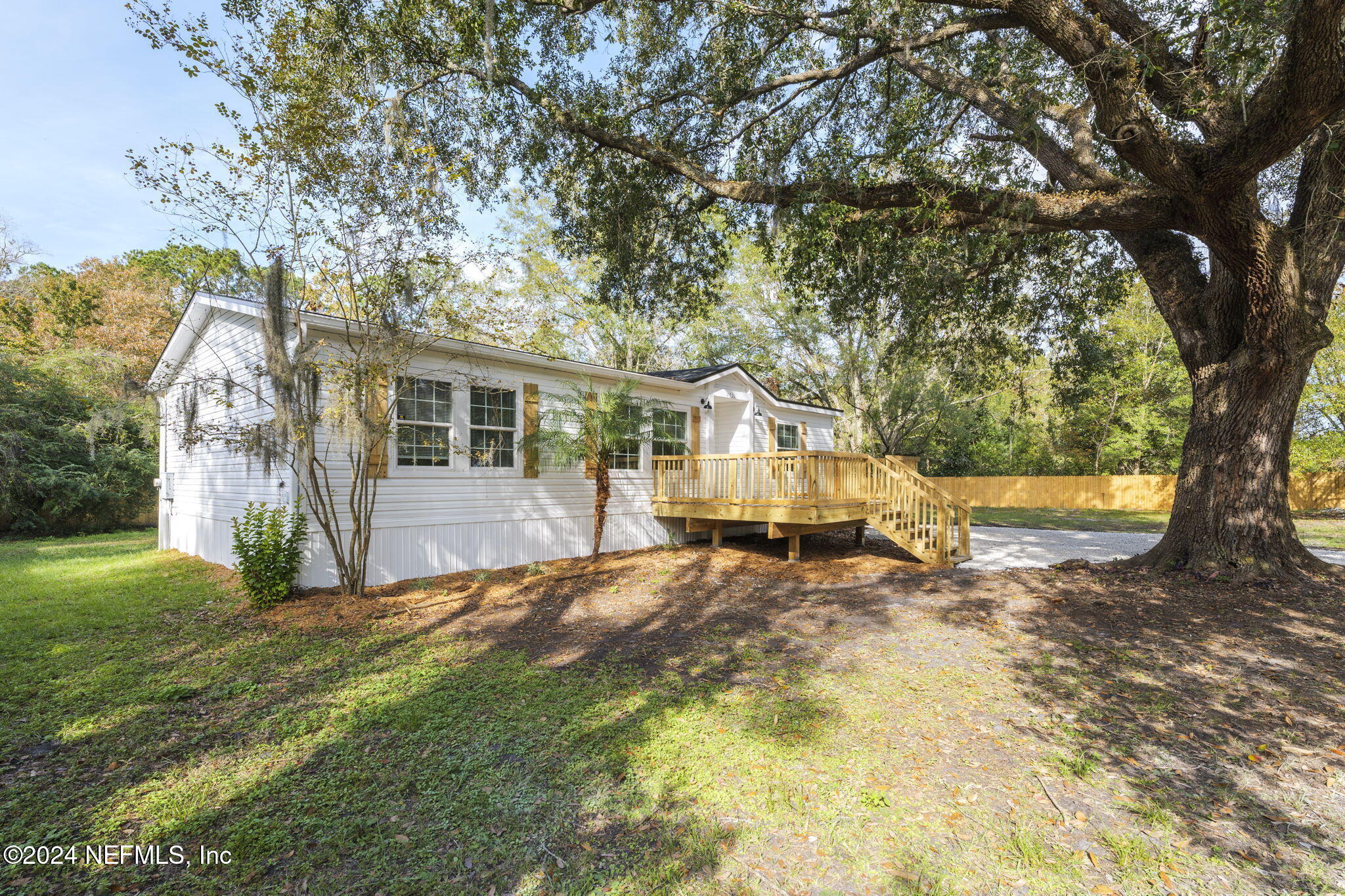 4526 Lambing Road Jacksonville, FL 32210 - Photo 28 of 32 a view of a house with a yard