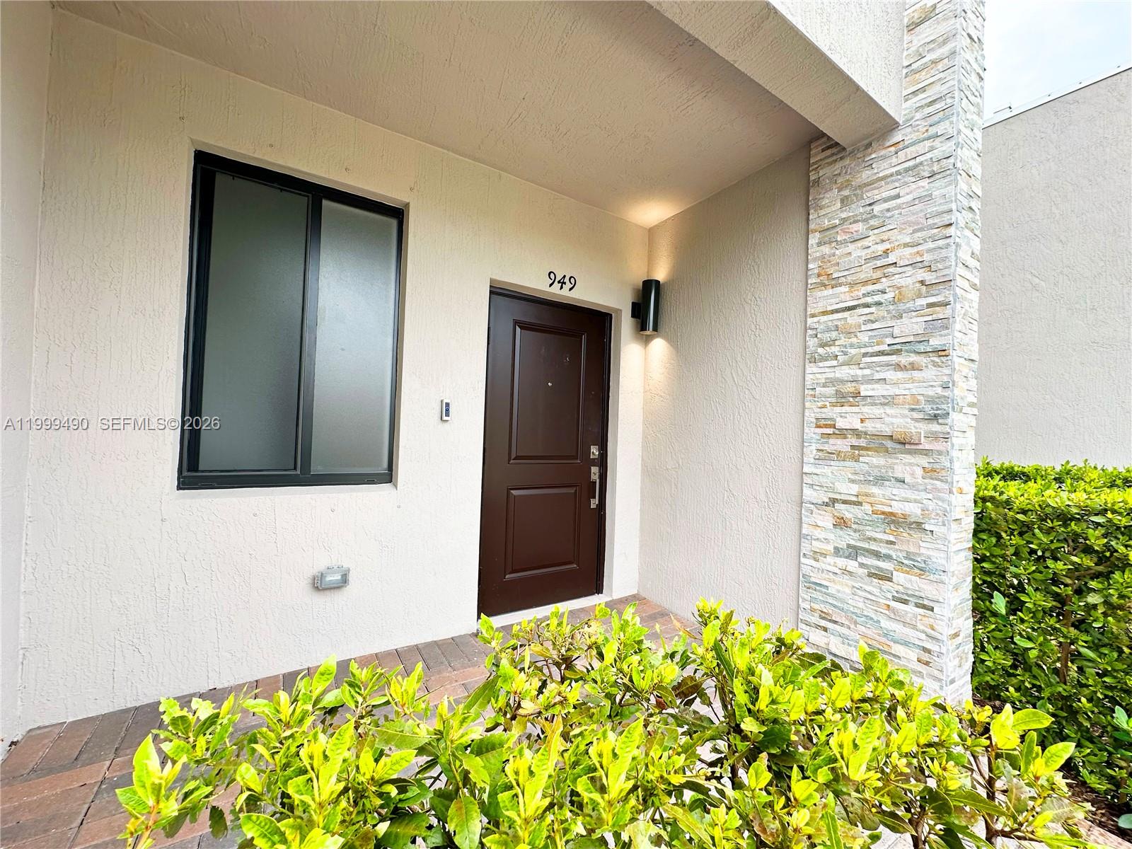 949 Northeast 211th Street Miami, FL 33179 - Photo 2 of 27 a view of a bathroom