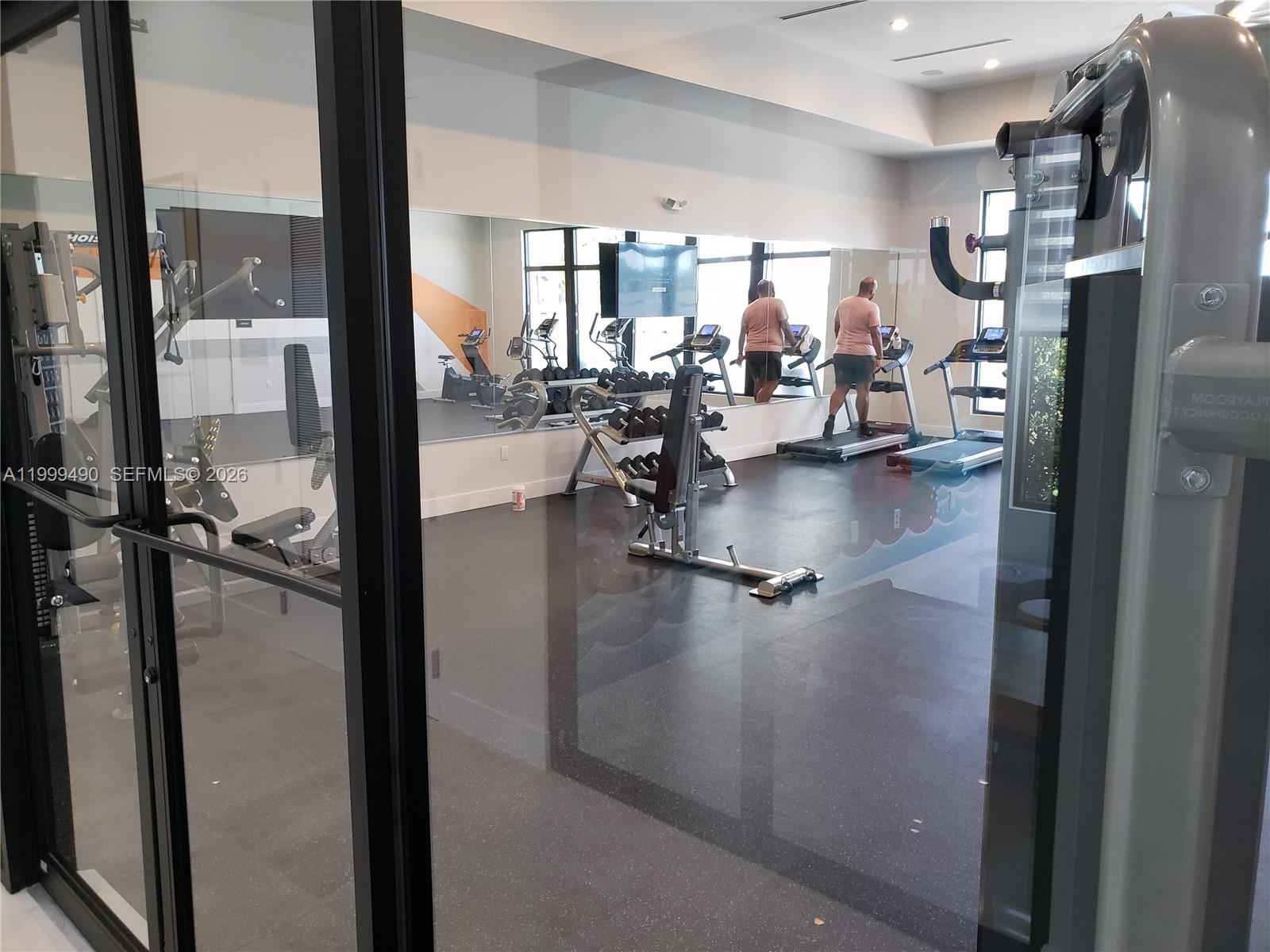 949 Northeast 211th Street Miami, FL 33179 - Photo 23 of 27 a view of a living room and dining room