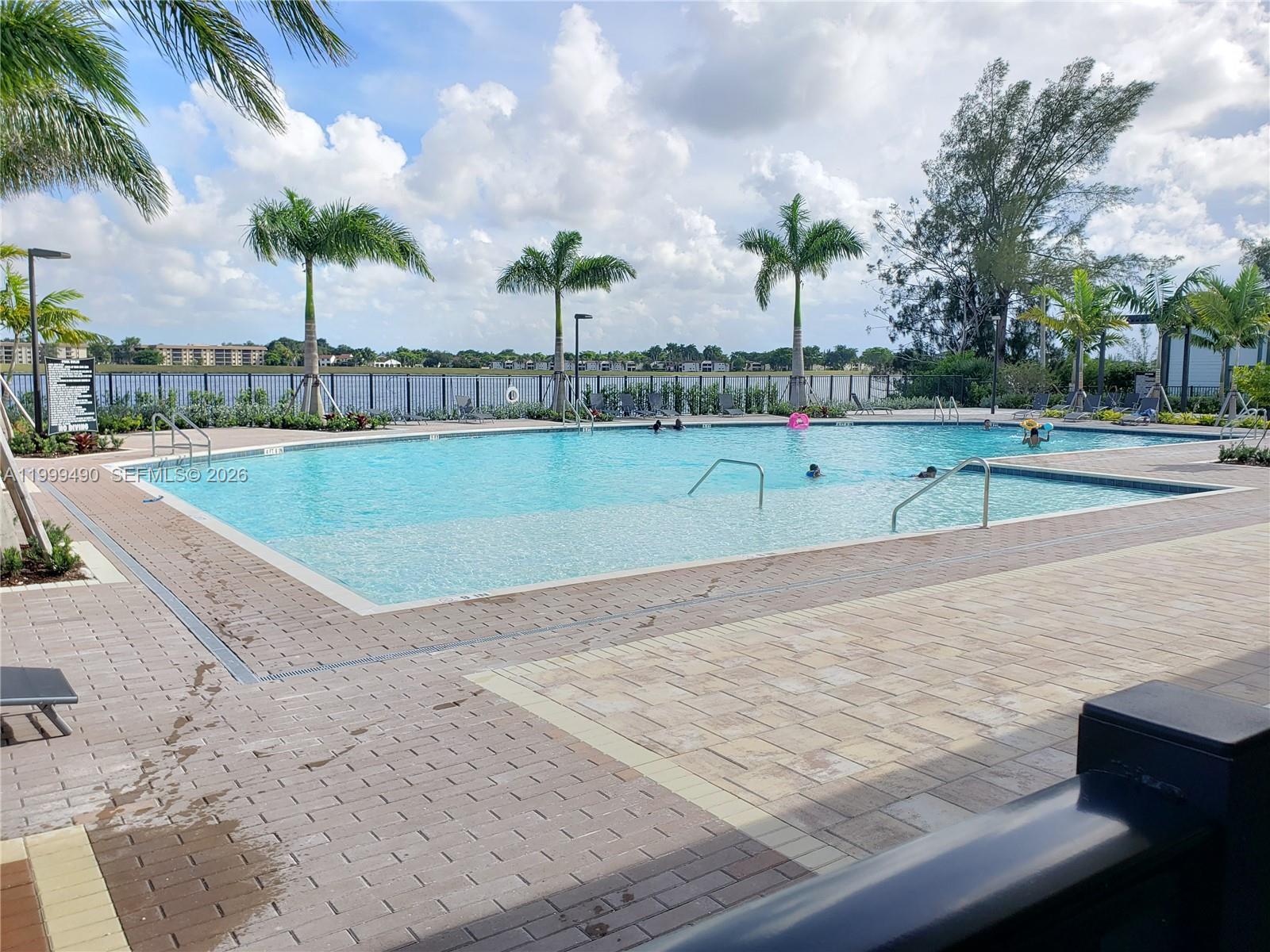 949 Northeast 211th Street Miami, FL 33179 - Photo 26 of 27 a view of an outdoor space and swimming pool