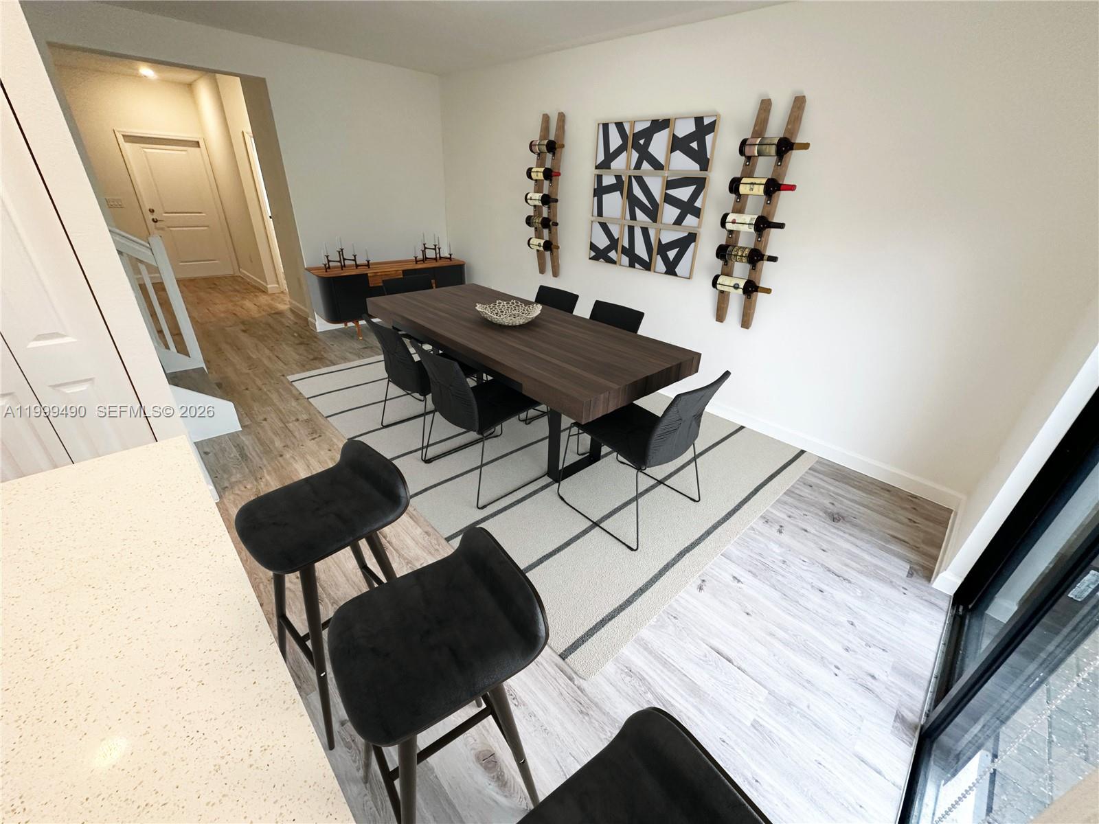 949 Northeast 211th Street Miami, FL 33179 - Photo 9 of 27 a living room with a couch and a table